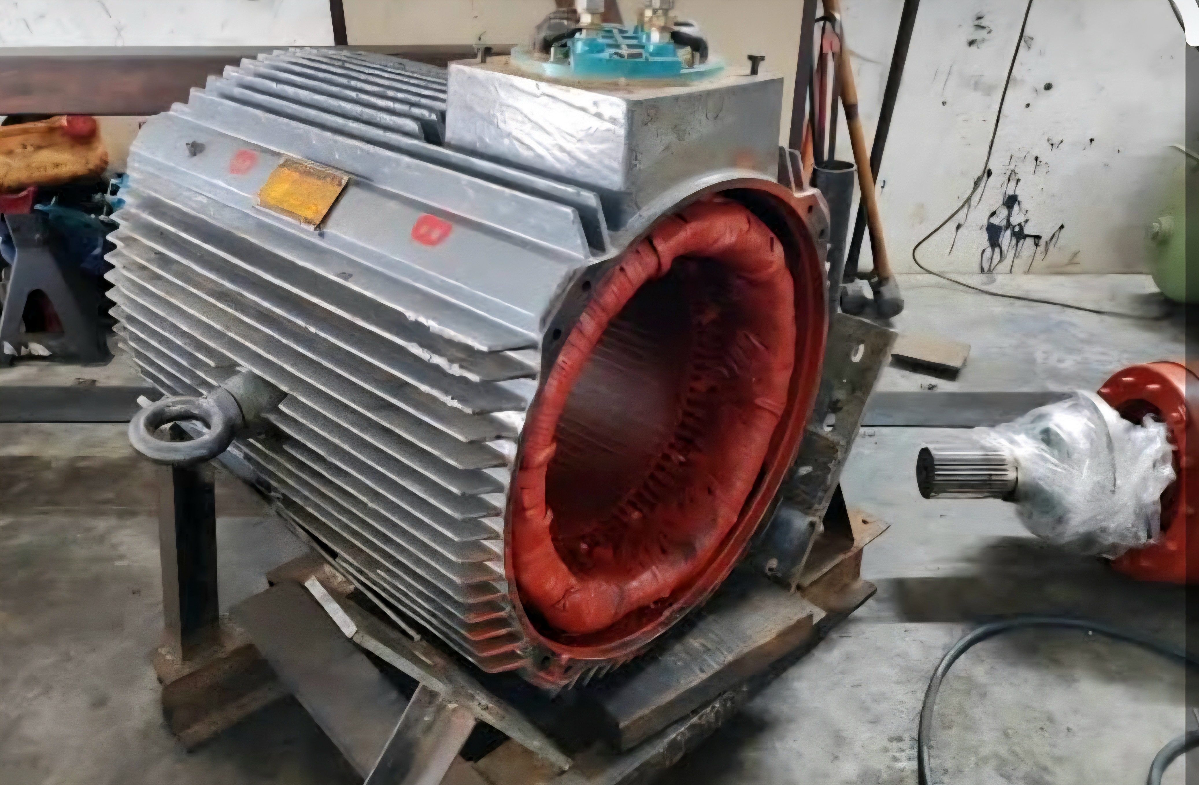 Large industrial electric motor on workshop stand